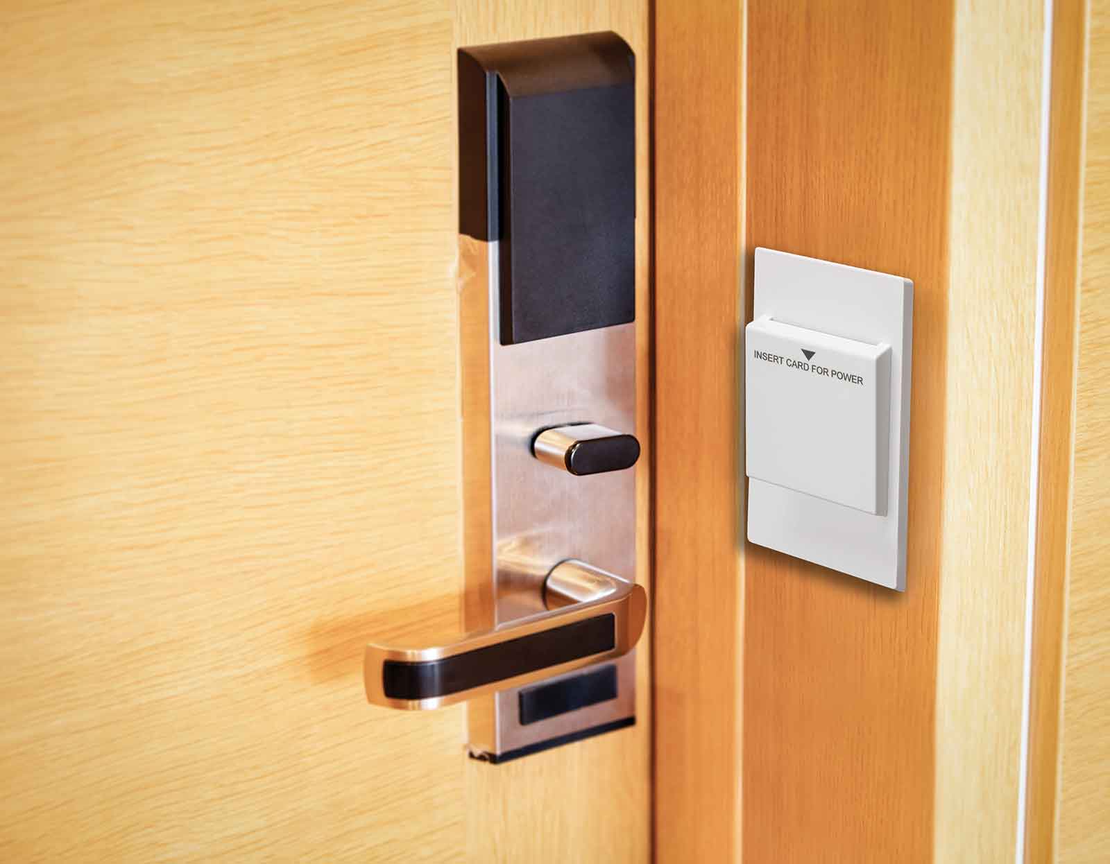 A card-operated controls unit mounted on a door frame