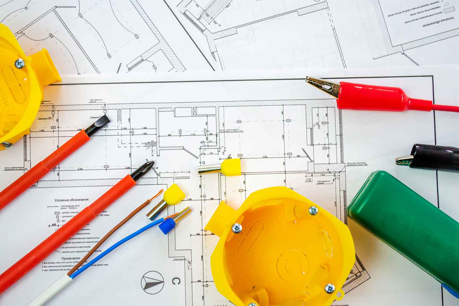 Service Contracts Contractor gear such as helmets and cables are shown atop schematic diagrams